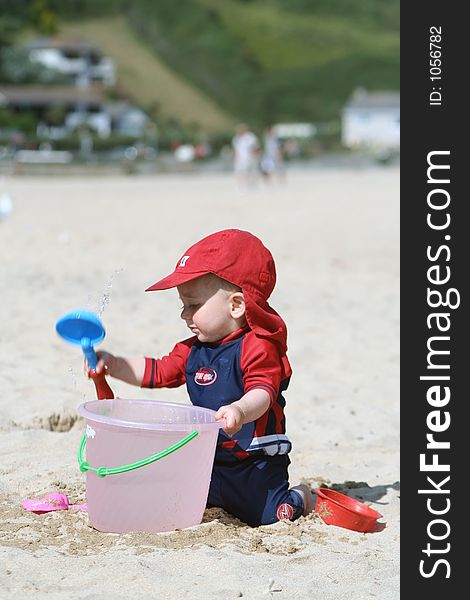 Small child exploring a beach in Cornwall. Small child exploring a beach in Cornwall.