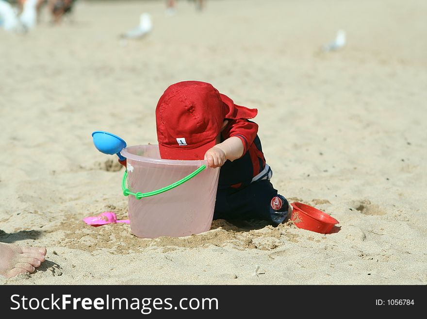 Small child exploring a beach in Cornwall. Small child exploring a beach in Cornwall.