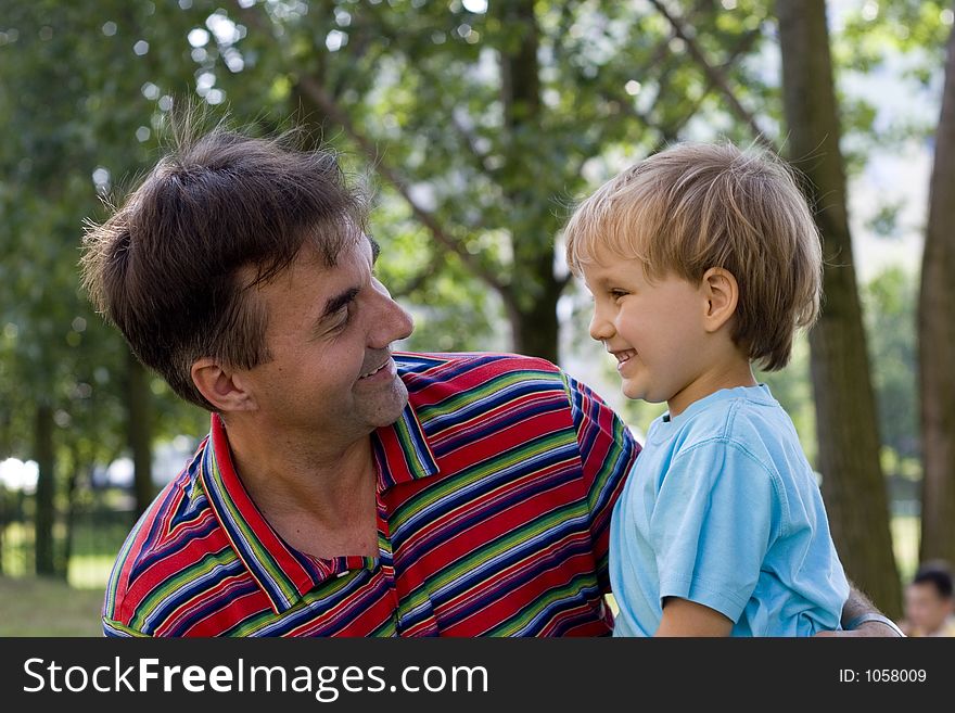 Smiling boy with uncle. Smiling boy with uncle