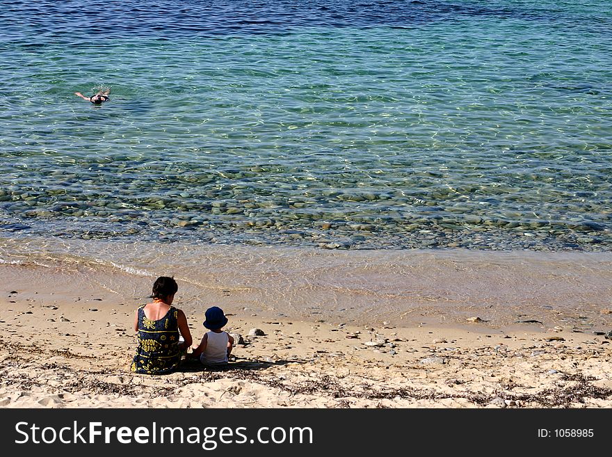 Corsica   Bay of Calvi, people on the beach. Corsica   Bay of Calvi, people on the beach