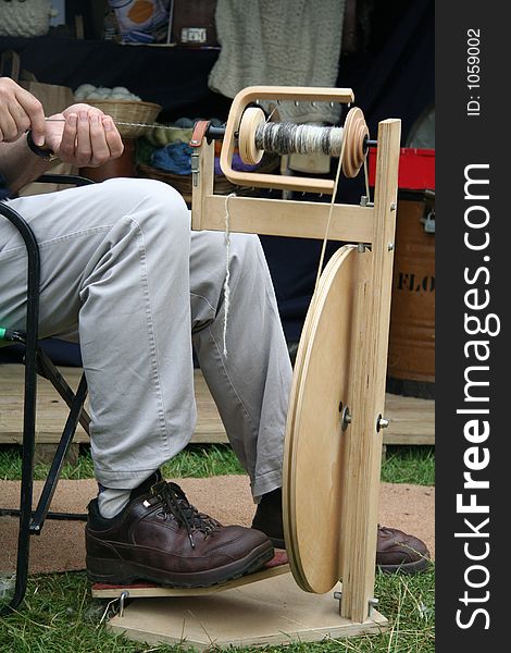 Modern spinning wheel in action. Modern spinning wheel in action