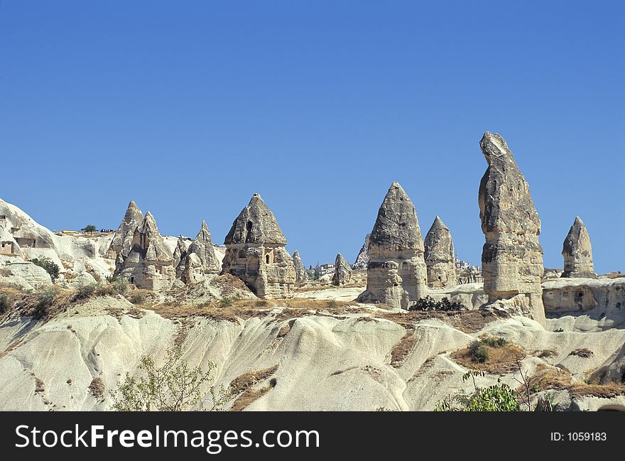 Old destroyed troglodyte houses digged in tuff in Cappadocia, Turkey