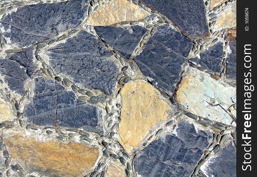 Pavement texture with different stone colors and shapes