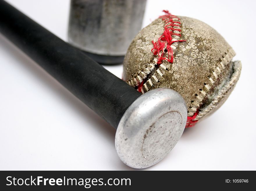 Torn Baseball and Bat in isolated