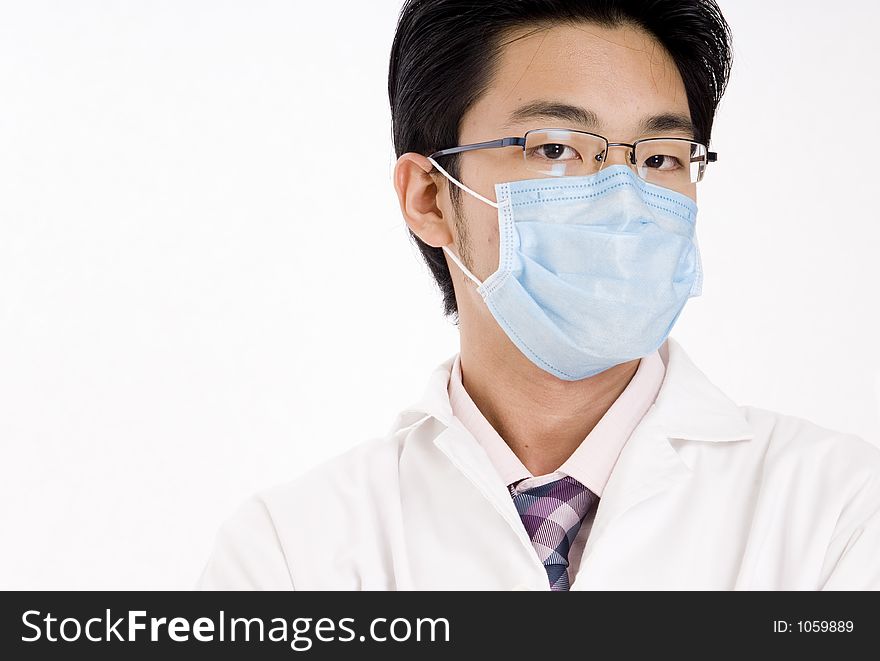A young asian man in blue face mask and white coat