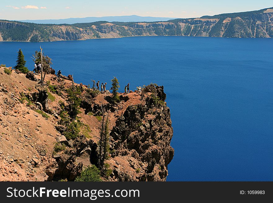 Cliff with tourists at Crater Lake, Oregon. Cliff with tourists at Crater Lake, Oregon