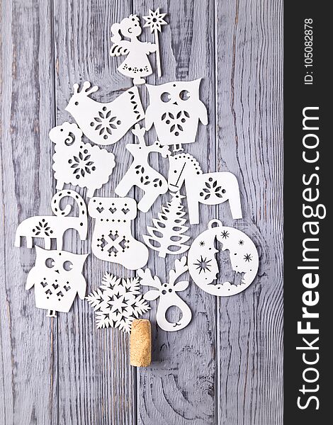 Christmas Composition On A Gray Background. Christmas Tree Composed Of Wooden Christmas Decorations