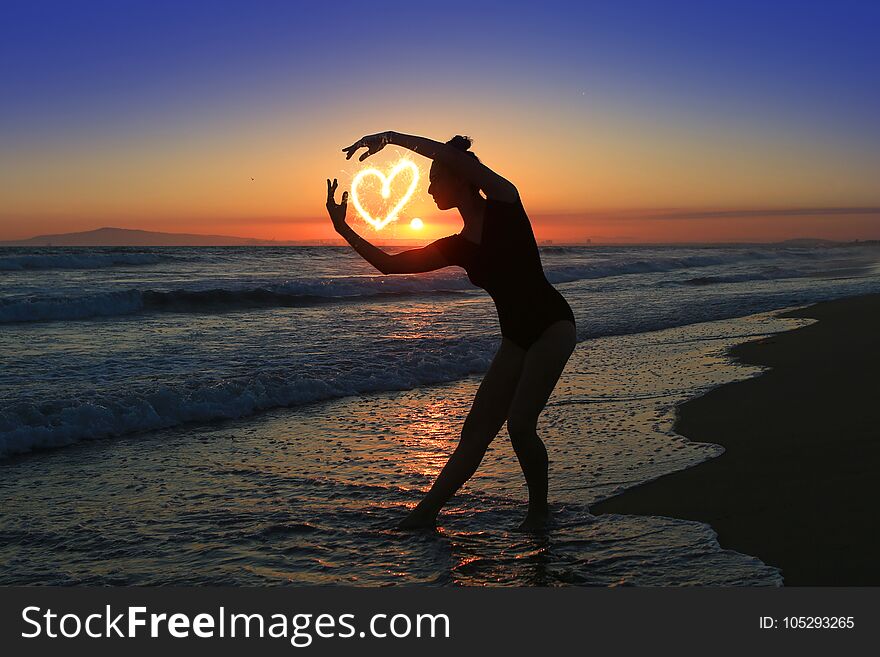 Skilled Young Dancer at the Beach During Sunset