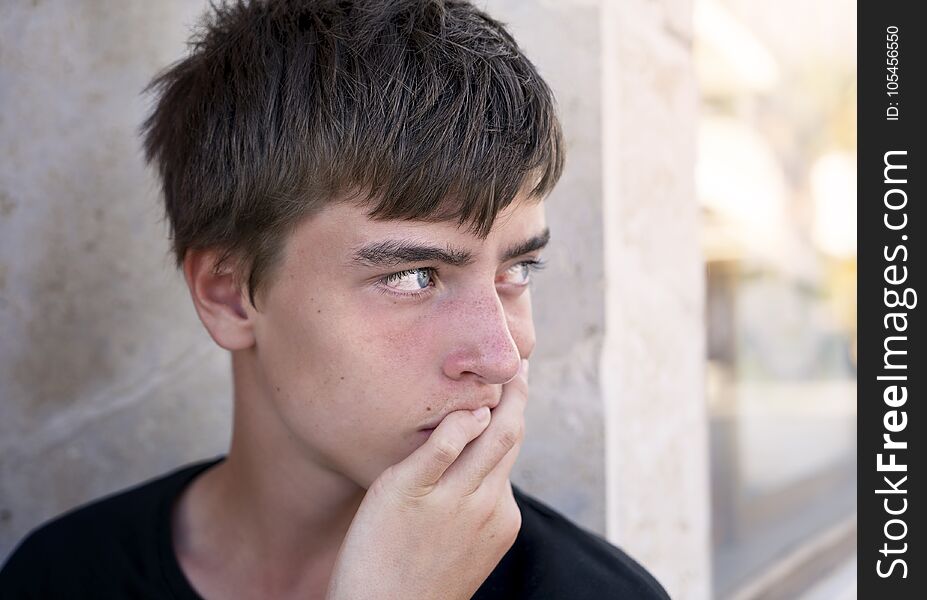 Portrait of a young man leaning on his hand