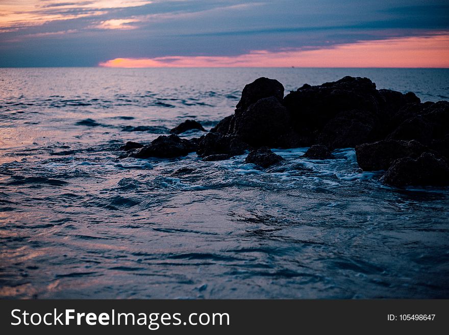 Rocky Sea Shore during Sun Set