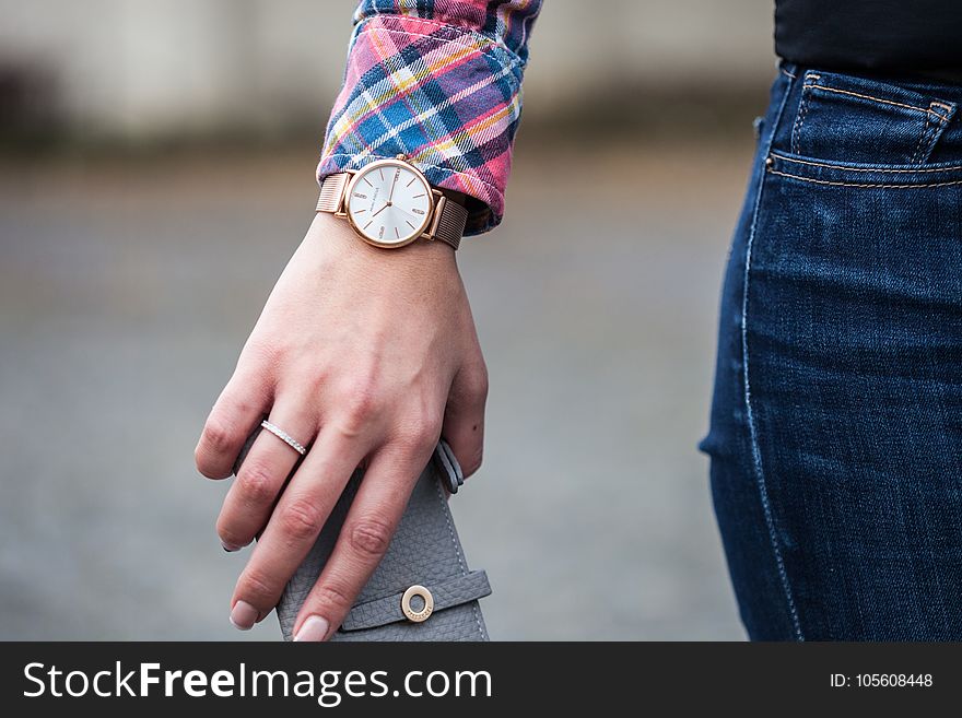 Closeup Photo of Person Wearing Round Gold-colored Framed Analog Watch