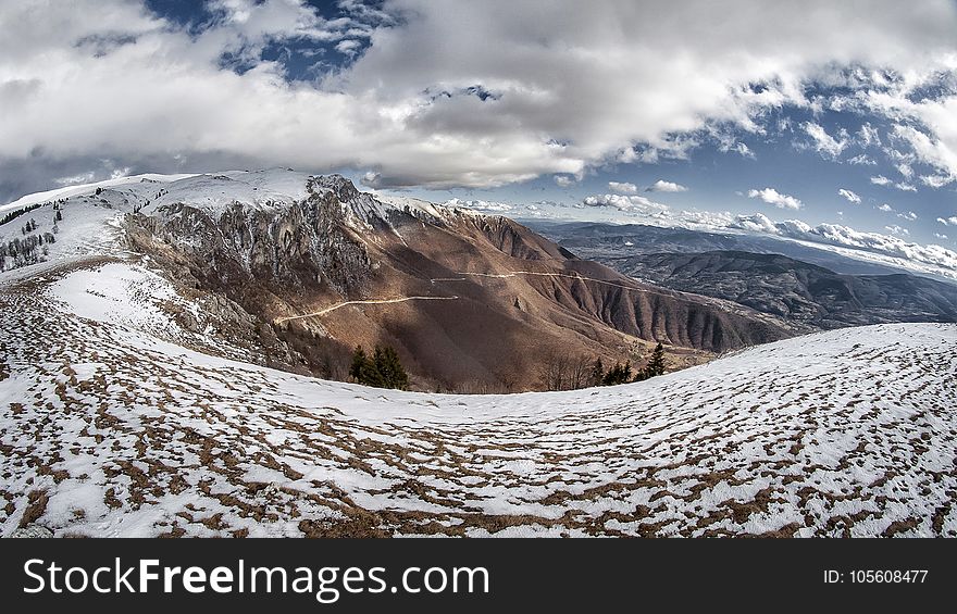 Landscape Photo of Snowy Mountain Under Cloudy Sky