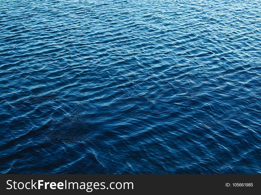 Blue Body of Water With Waves