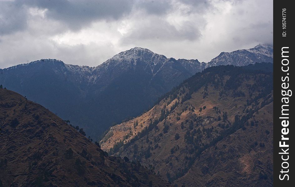 Brown Mountain Under White Cloudy Sky