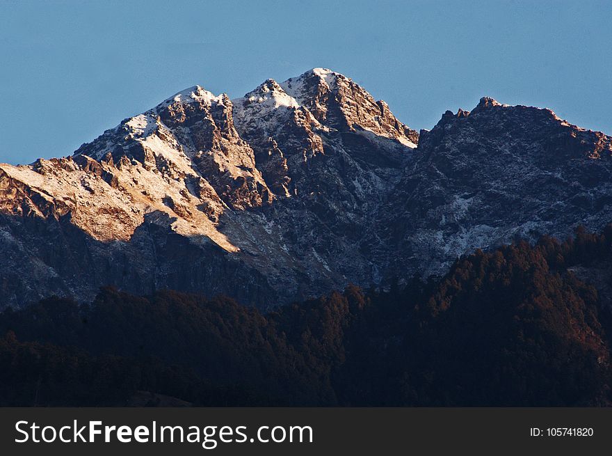 Brown And White Mountain Under Clear Sky