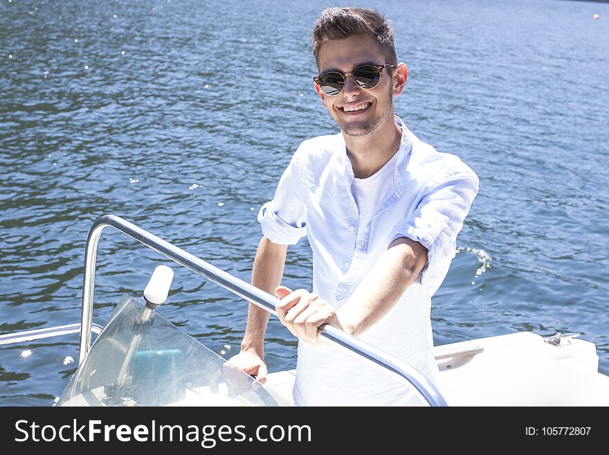 Young man on the yacht summer vacation