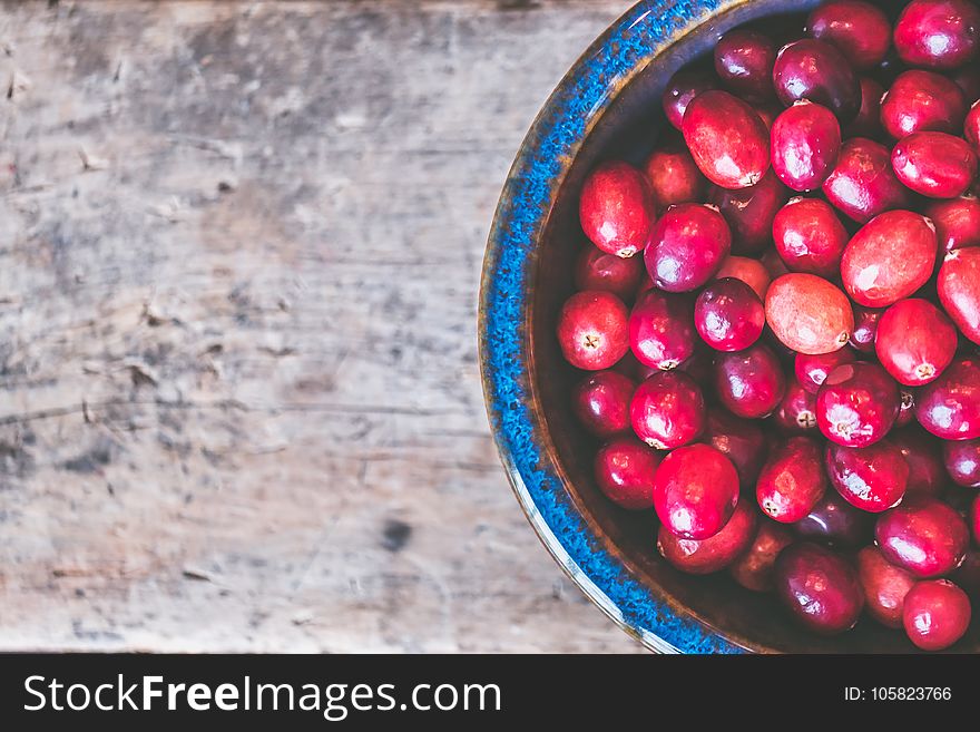 Bowl of Red Round Fruits