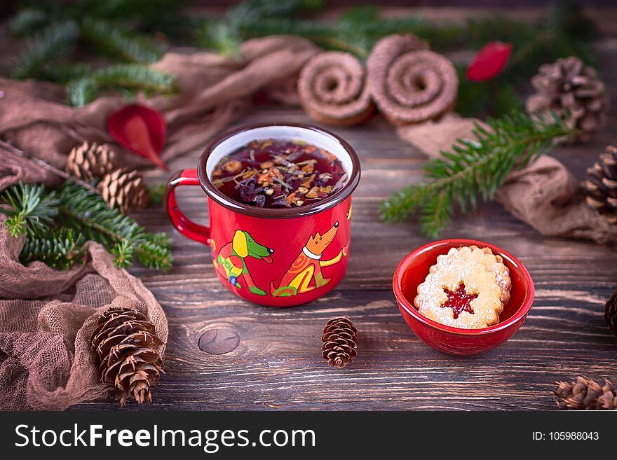 Fruit tea and Christmas cookies in a ceramic bowl on a Christmas background