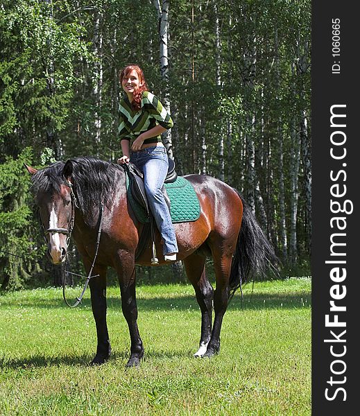 Girl on chestnut horse in summer day. Girl on chestnut horse in summer day