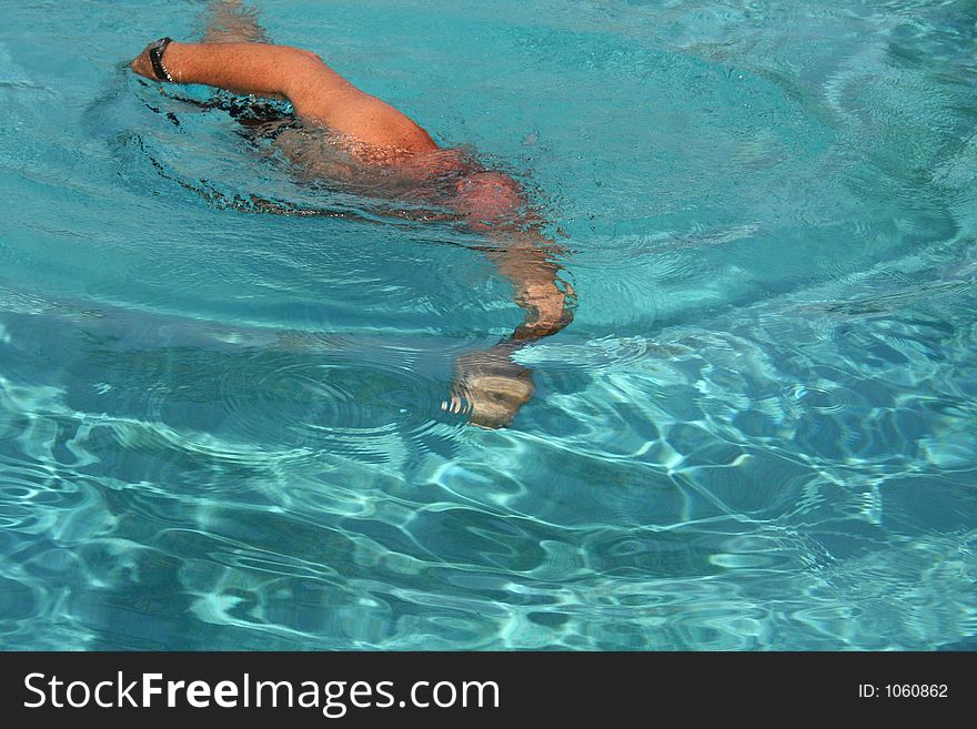Man Swimming in a pool. Man Swimming in a pool