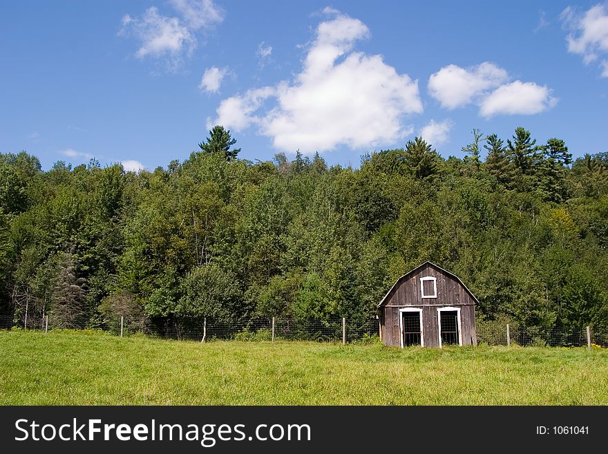 A small barn in a meadow in rural Quebec. A small barn in a meadow in rural Quebec