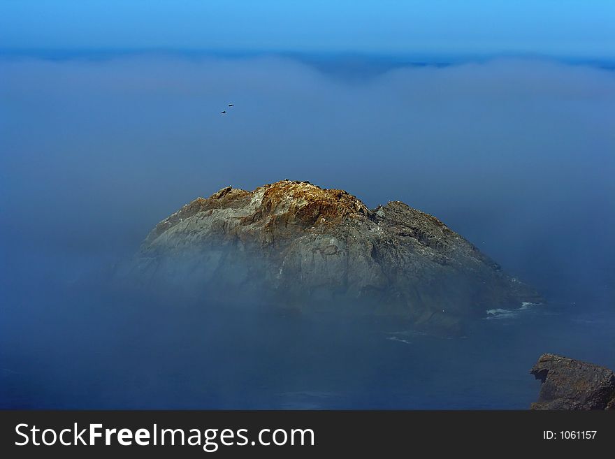 Island in fog near Brookings, Oregon. Island in fog near Brookings, Oregon