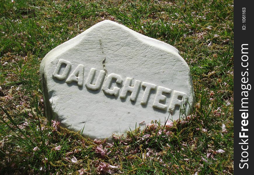 A gravestone with the word Daughter. A gravestone with the word Daughter