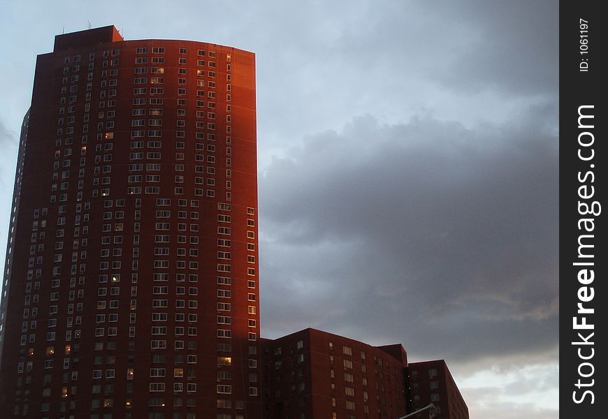 A building under dark clouds. A building under dark clouds