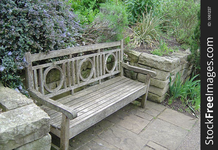 Old bench in Queens park in London