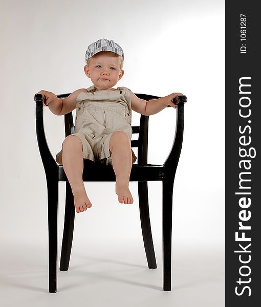 Little boy with a chair. Little boy with a chair