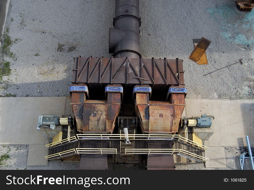 Furnace manifold fans leading to an industrial stack.