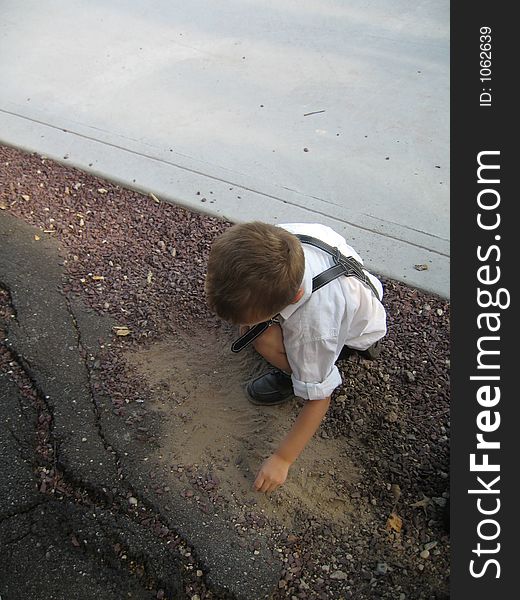 German child playing in dirt
