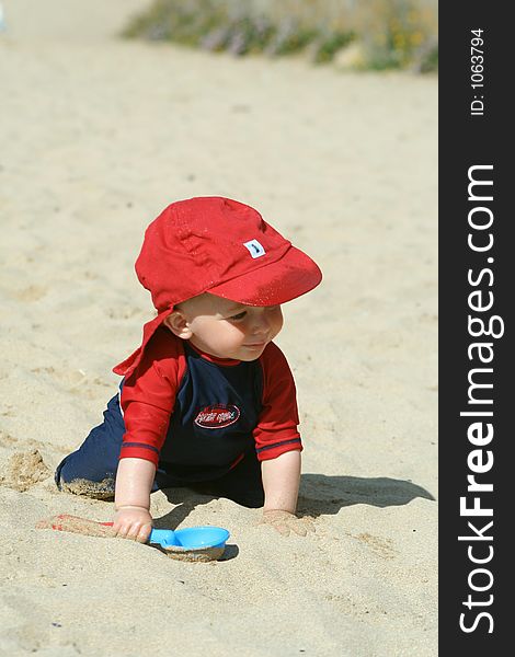 Small child exploring a beach in Cornwall. Small child exploring a beach in Cornwall.