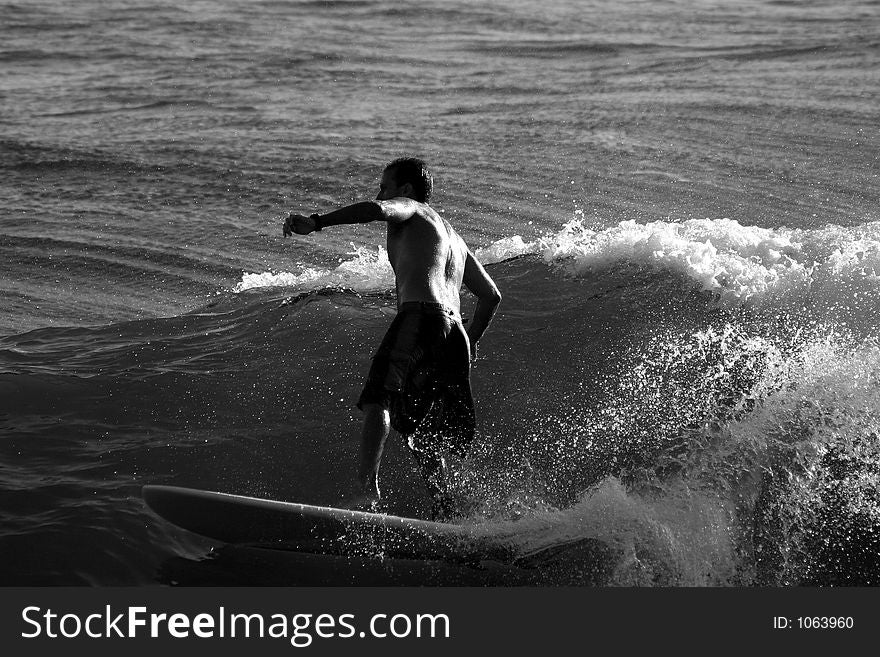 Surfer in the evening light, black and white. Surfer in the evening light, black and white