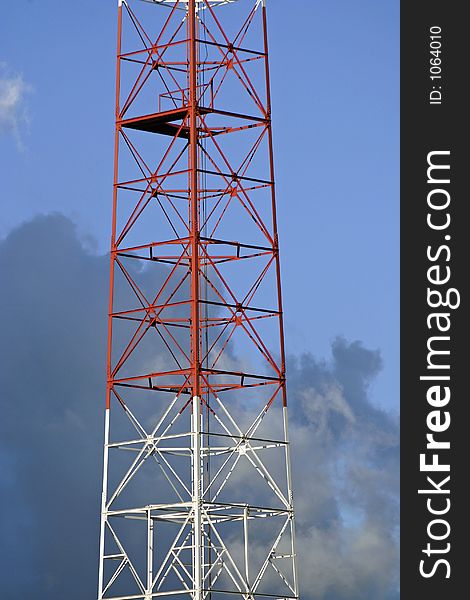 Telecommunication tower over a beautiful afternoon sky