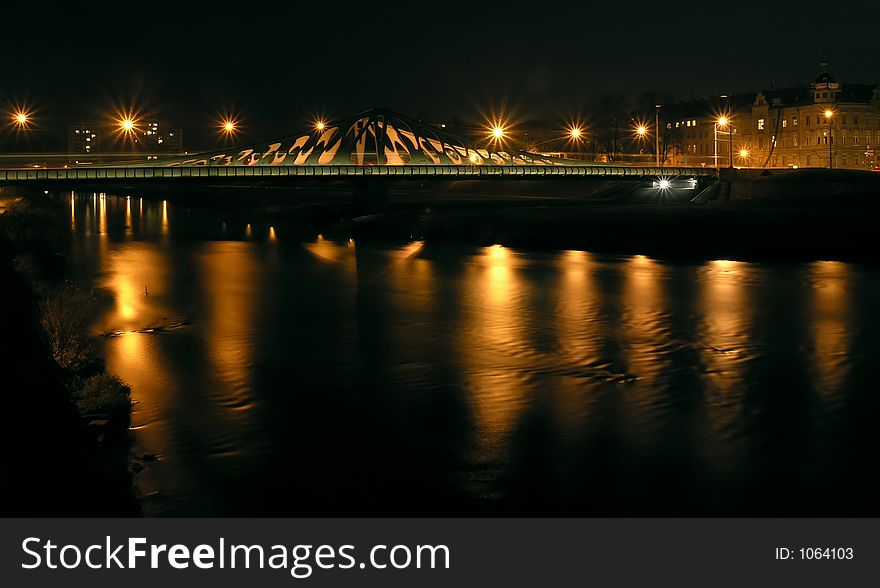 Bridge at night with reflecting lights