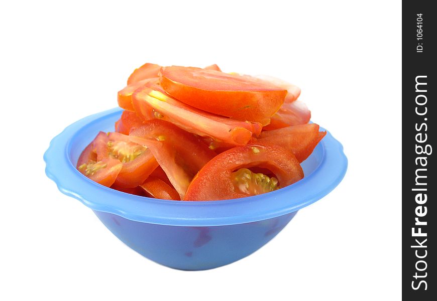 Tomato salad in blue bowl isolated on white