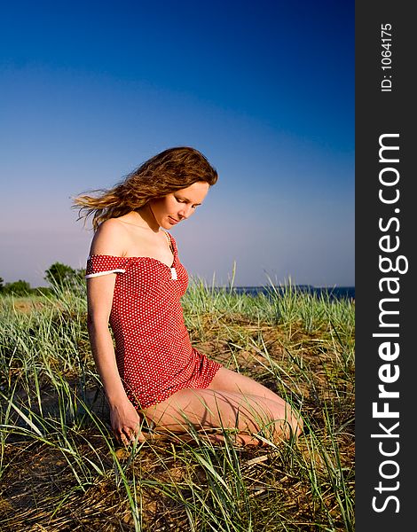 Girl Sitting On A Dune-9