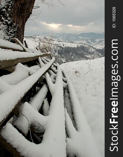 Fence covered with snow in winter. Fence covered with snow in winter