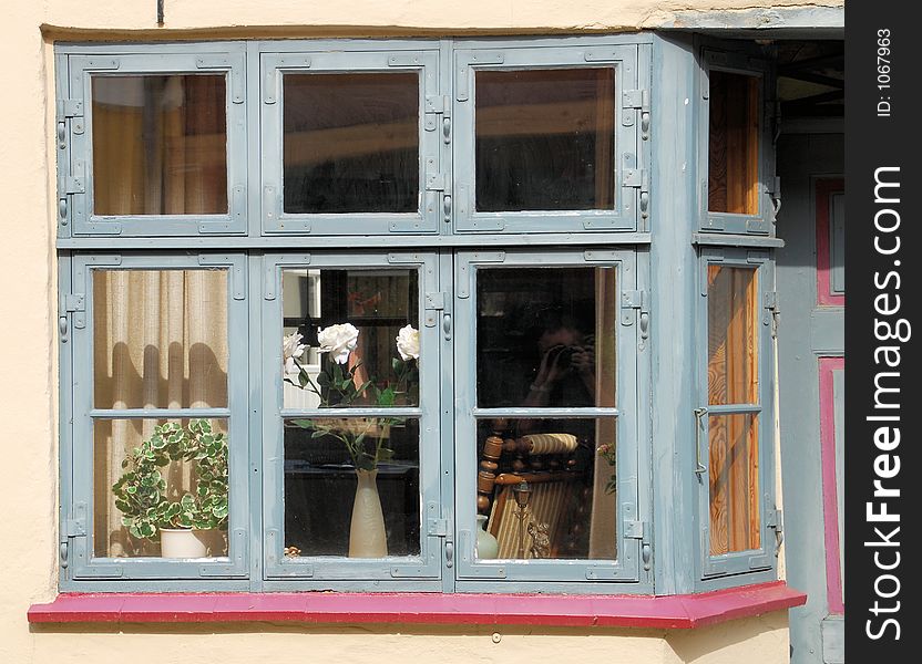 A beautiful window in a town in the Jutland part of Denmark. A beautiful window in a town in the Jutland part of Denmark.