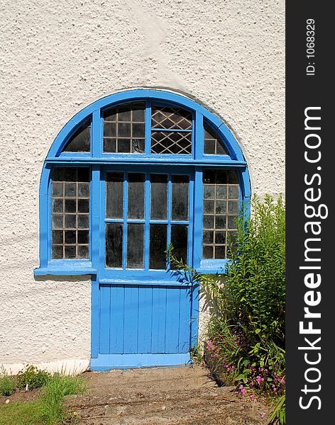 A window-door or door-window on the island of Caldey off the Pembrokeshire coast. A window-door or door-window on the island of Caldey off the Pembrokeshire coast.