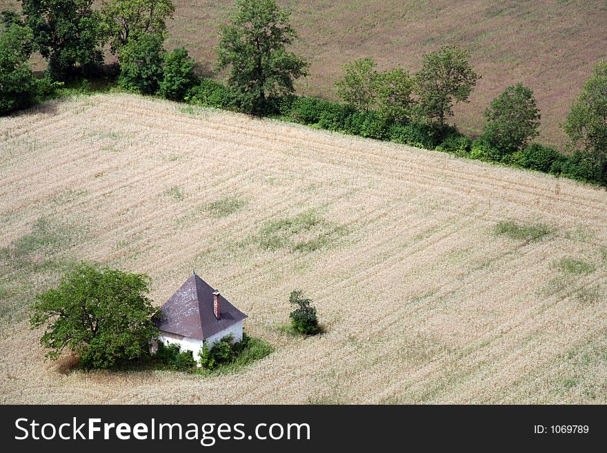 Small house in a field. Small house in a field