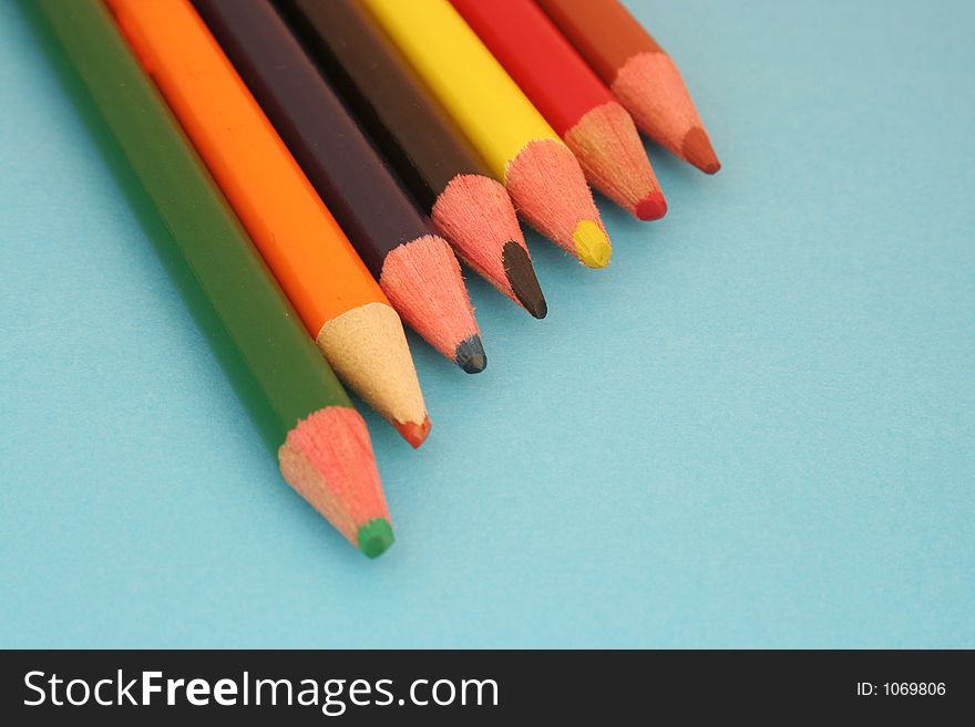 Row of colorful wooden  crayons