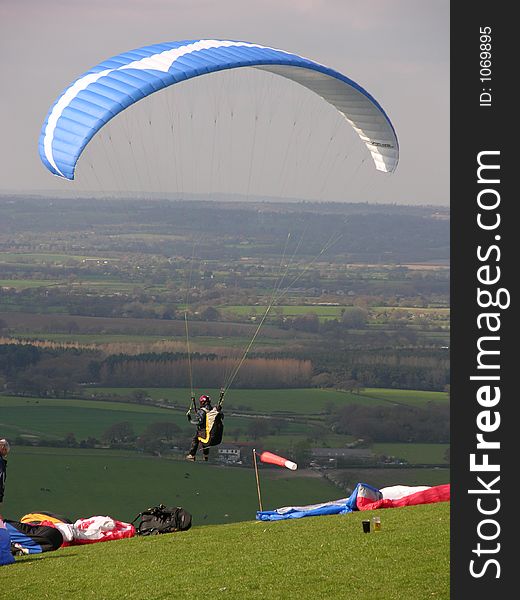 Paraglider takes of into clear air. Paraglider takes of into clear air