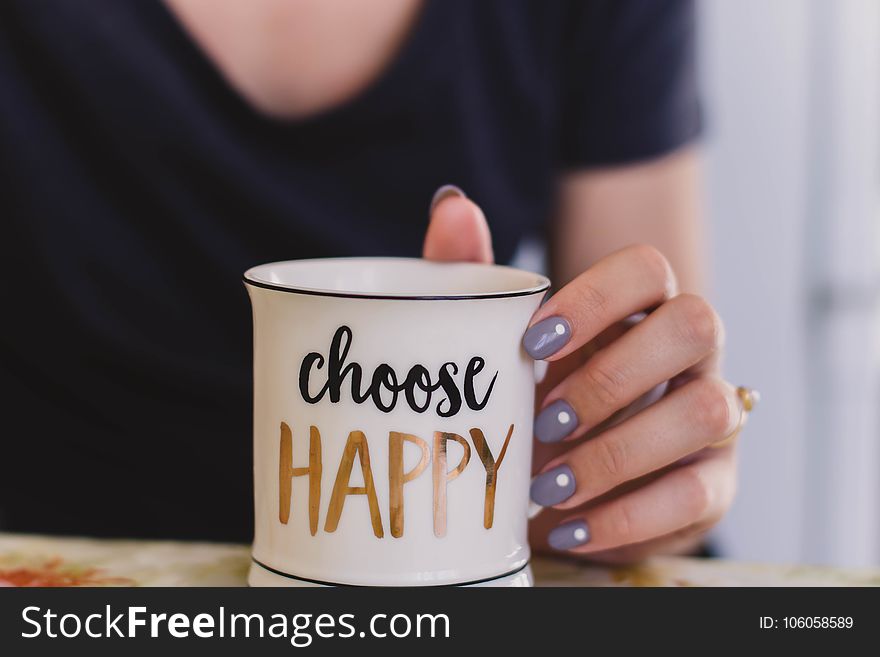 Selective Focus Photography of Person Touch the White Ceramic Mug With Choose Happy Graphic