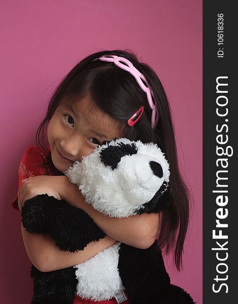 Little chinese girl with Panda Bear