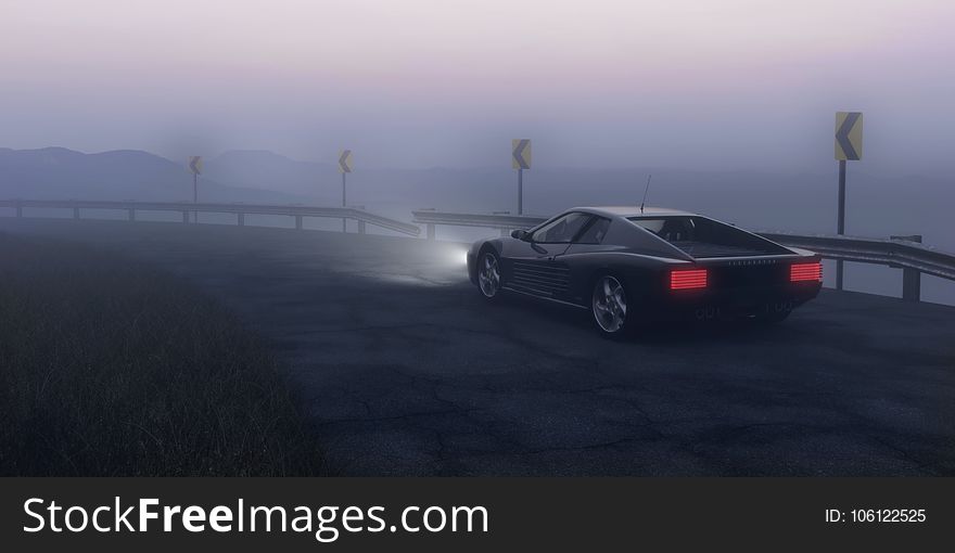 Black Coupe Parked on Concrete Road Near Body of Water
