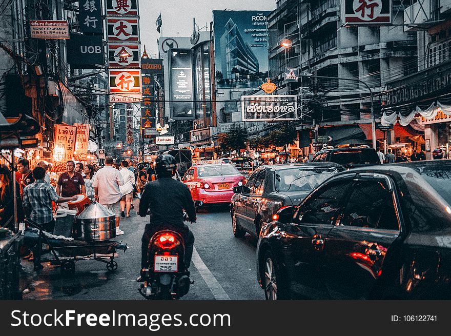Crowded Street With Cars Passing By