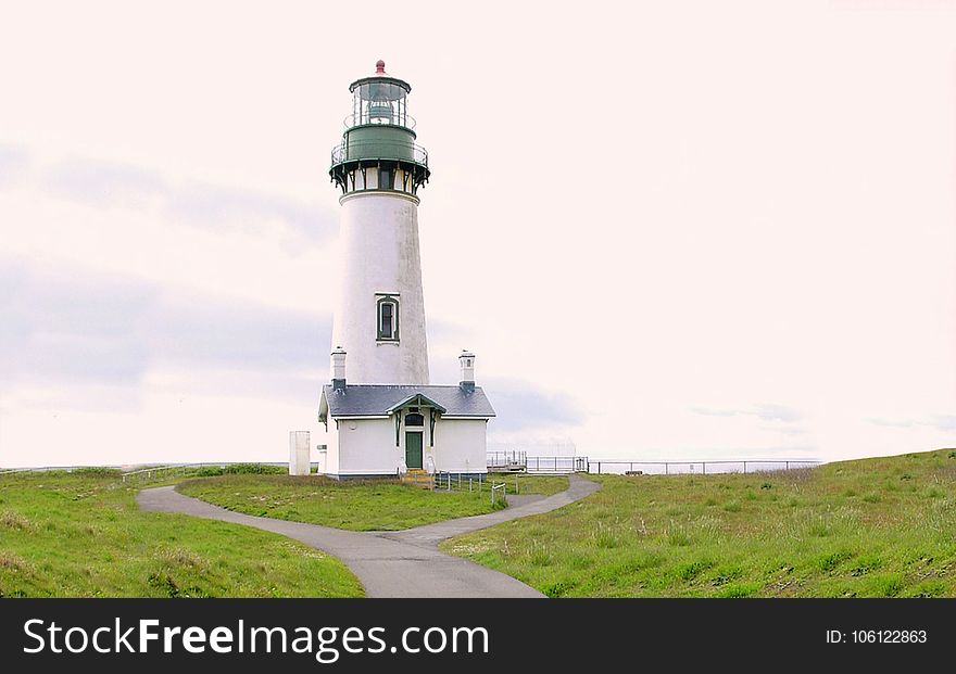 White and Gray Lighthouse Photo during Day