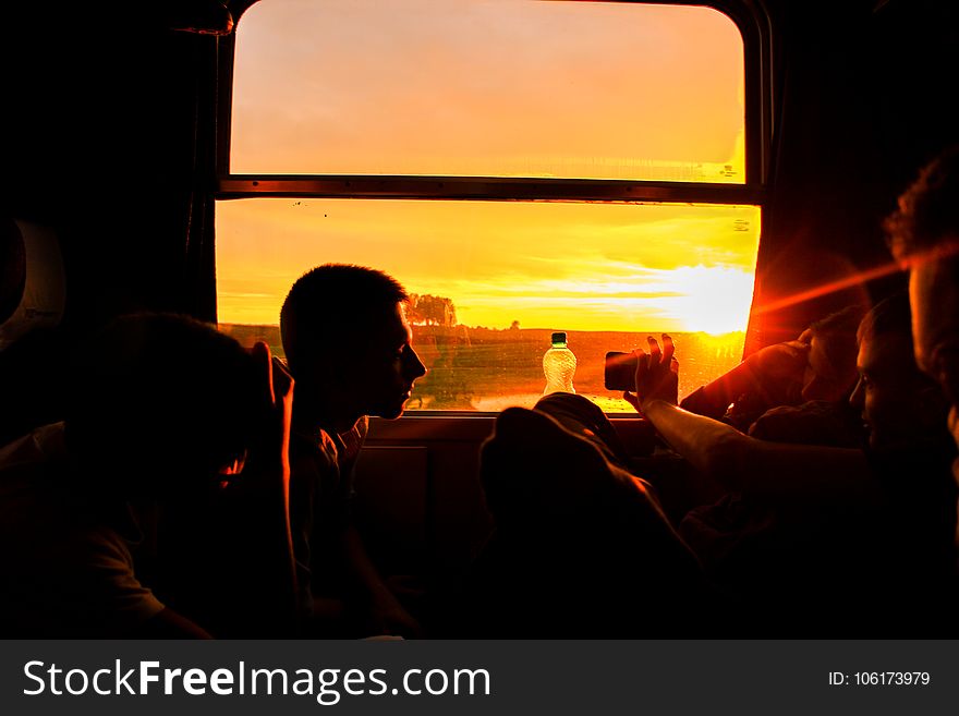 Silhouette Of Man Sitting During Sunset